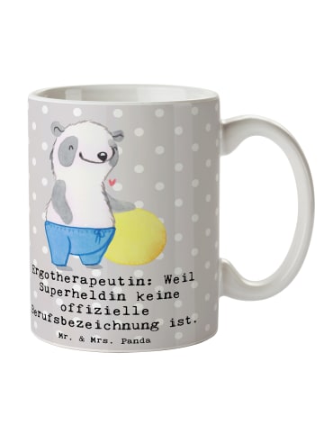 Mr. & Mrs. Panda Kaffeetasse Ergotherapeutin Superheldin mit Spruch in Grau Pastell