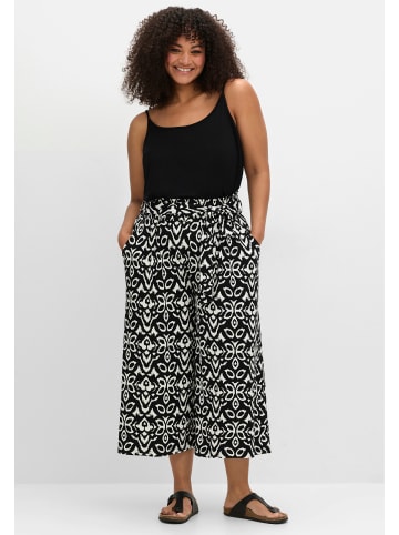 sheego Schlupfhose in schwarz-weiß