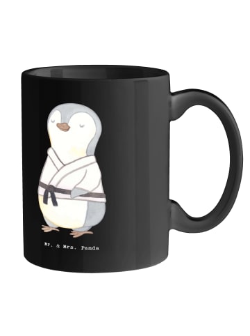 Mr. & Mrs. Panda Tasse Unerschütterliche Judo Trainerin mit Spruch in Schwarz