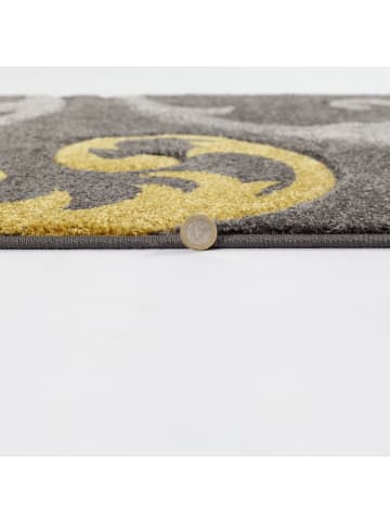 KADIMA DESIGN Abstrakter floraler Teppich in Gelb-Grau