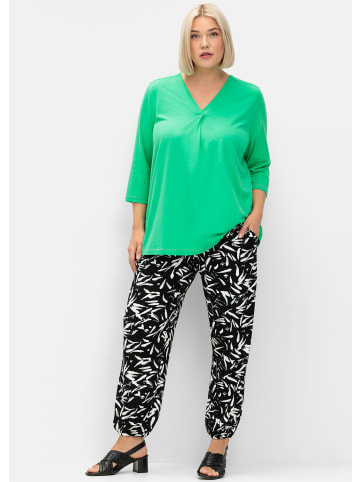 sheego Schlupfhose in schwarz-weiß