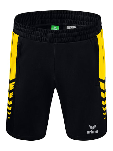 erima Six Wings Shorts in schwarz/gelb