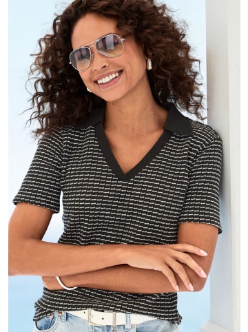 Poloshirt in schwarz-creme