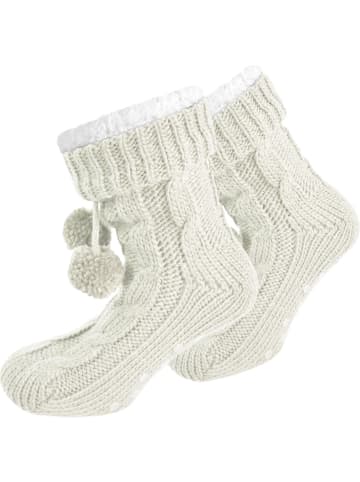Strick-Hausschuhe mit Bommeln und ABS in Wollweiß