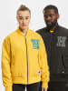 Champion College-Jacken in yellow/black