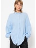 SASSYCLASSY Oversize Musselin Bluse in Hellblau