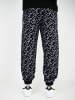 DADA Baggy Design Jogginghose All Over Print mit Kordelzug in Schwarz