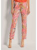 MADELEINE Farbige Schlupfhose mit grafischem Print in blutorange / multicolor