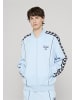 Hummel Track Jacket in light blue/navy