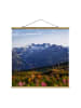 WALLART Stoffbild mit Posterleisten - Blumenwiese in den Bergen in Bunt