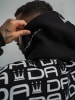 DADA Hoodie mit Allover Logo und Oversize Schnitt in Schwarz