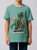 wat? Apparel T-Shirt T-Rex Fahrrad in Teal Monstera