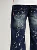 DADA Loose Fit Jeans mit Splatters und Dada Stitching in Blau