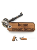 Mr. & Mrs. Panda Glücksbringer home sweet home mit Spruch in Pflanze