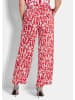 GOLDNER Druckhose mit floralem Muster in rot / weiß / gemustert