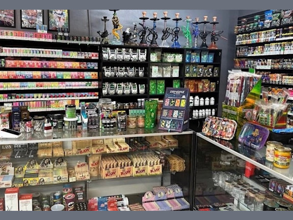 Absentee-Run Smoke Shop with Property