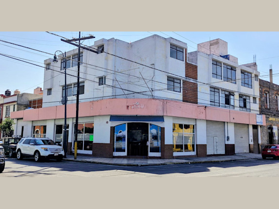 Sale of commercial building and apartments.