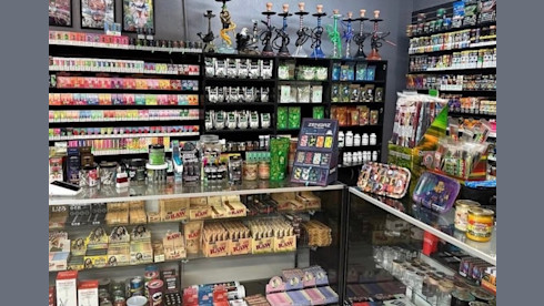 Absentee-Run Smoke Shop with Property