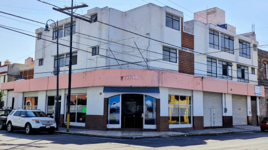 Sale of commercial building and apartments.