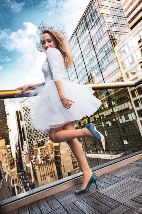 woman wearing Manolo Blahniks on rooftop in New York City 