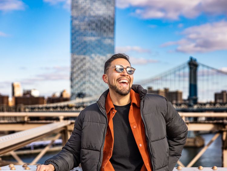 hot guy standing by the Manhattan bridge 