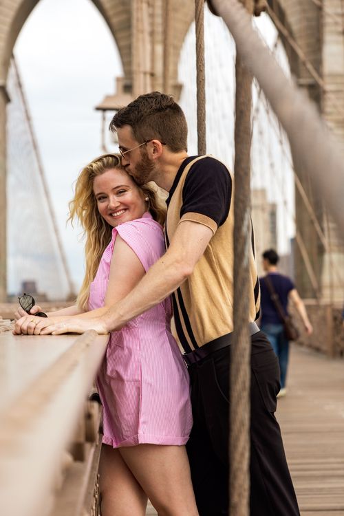 guy kisses girl on the Brooklyn bridge 