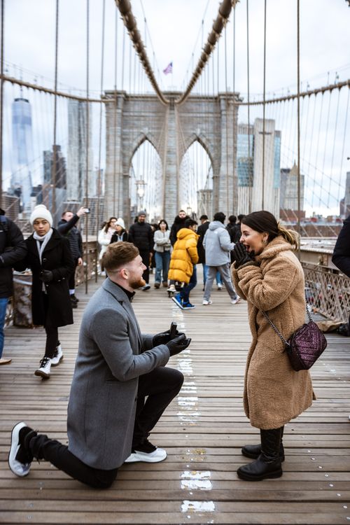 girl getting married on the Brooklyn Bridge with wedding ring 