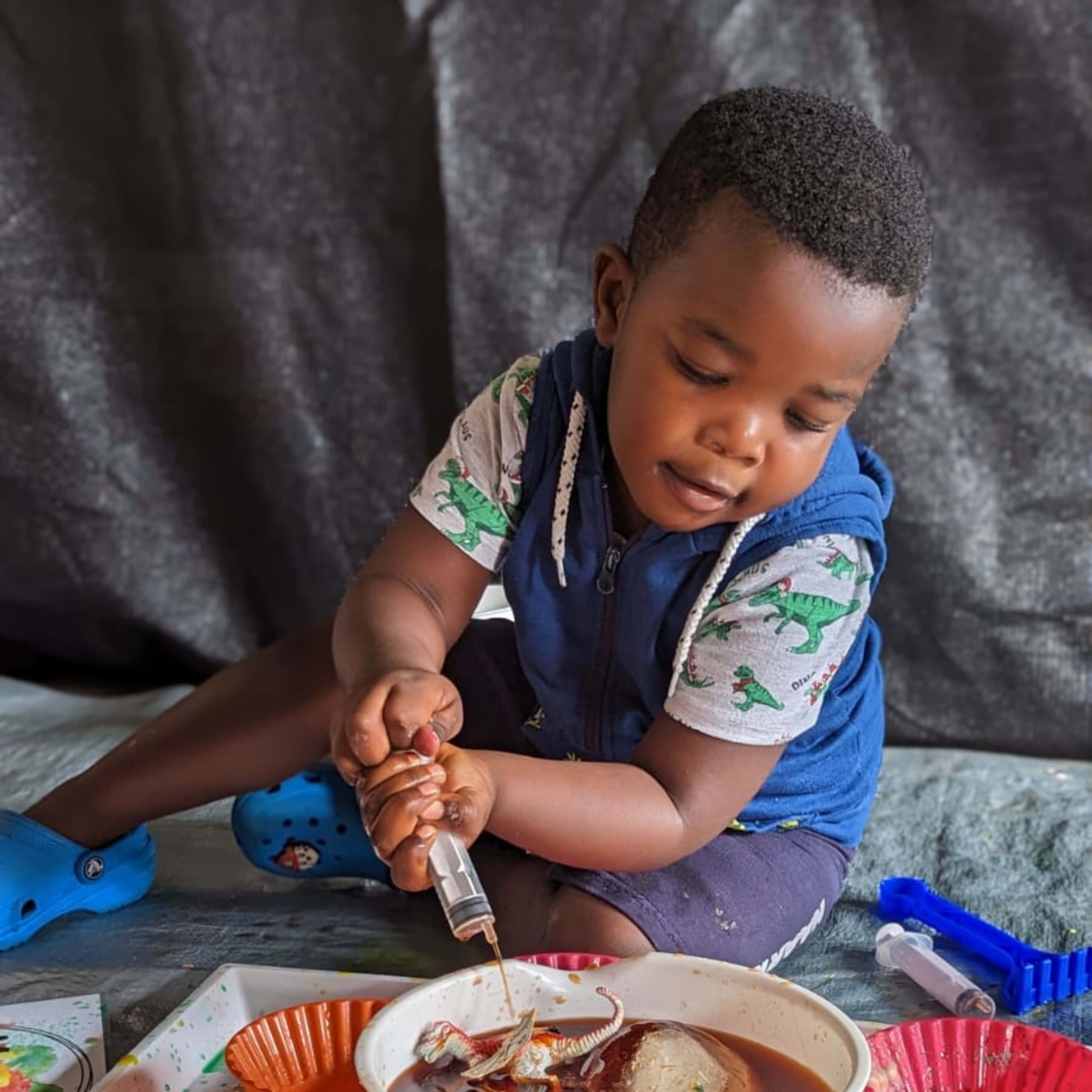 Child playing with bicarb and experimenting