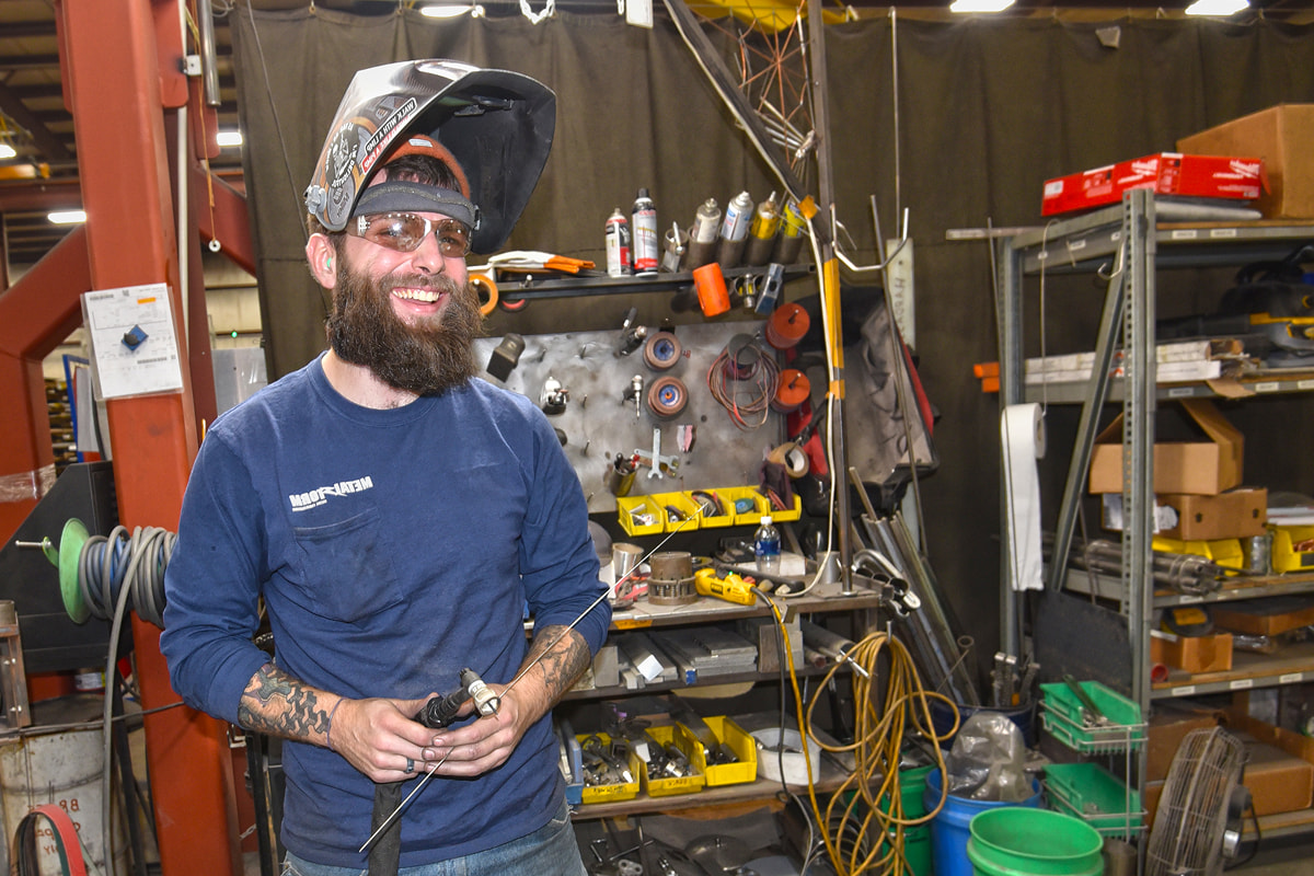 MetalStorm welder posing for a picture while working on a welding project
