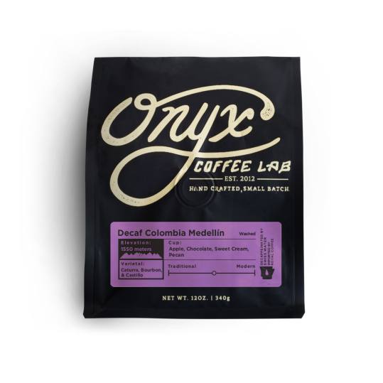 Bag of whole bean Decaf Colombia Medellín coffee, roasted by Onyx Coffee Lab