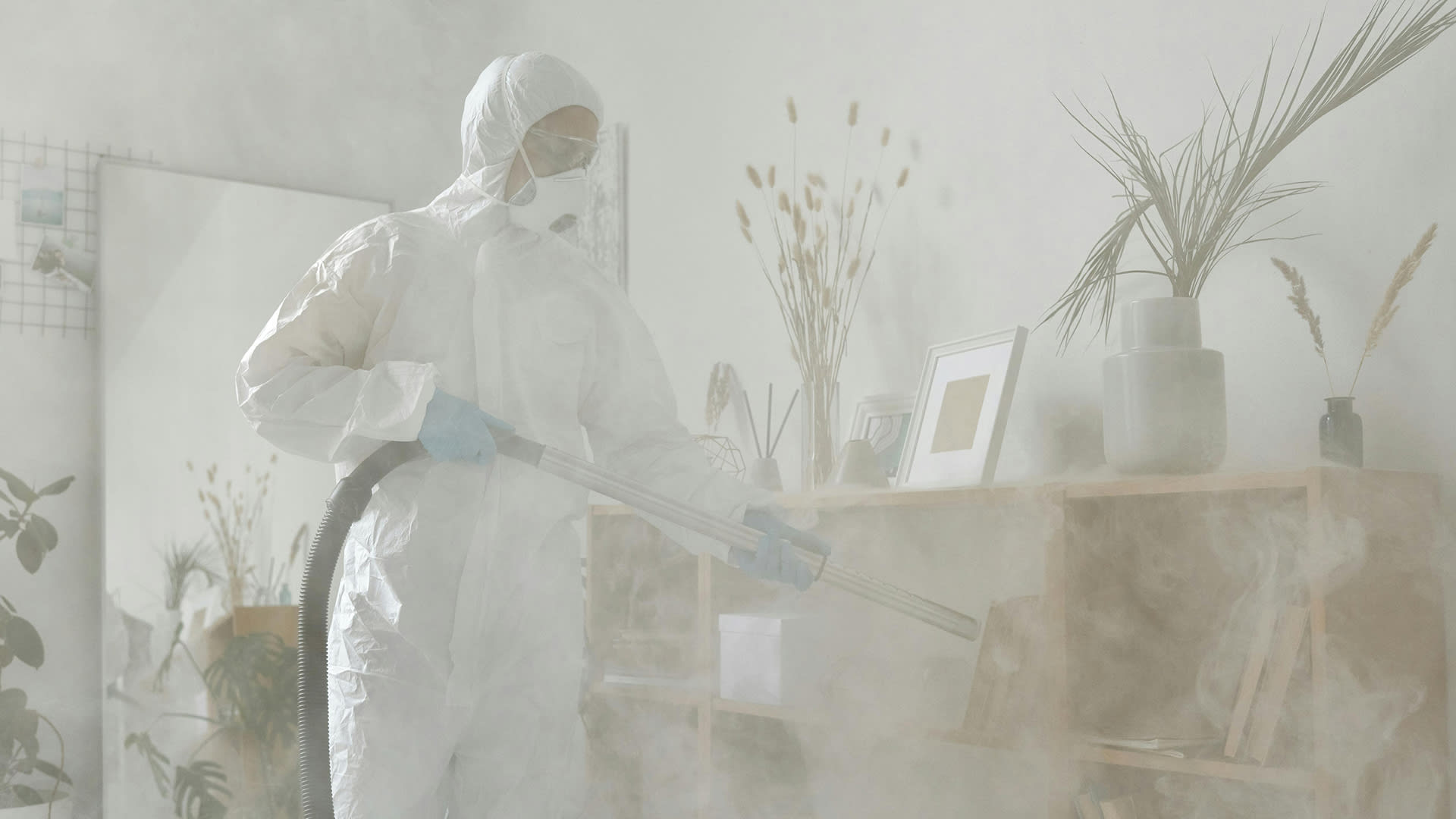 MSA Termite technician performing safe indoor pest control treatment in a residential home.