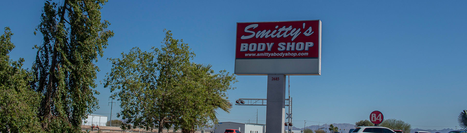 The street sign for Smitty's body shop in Yuma AZ.