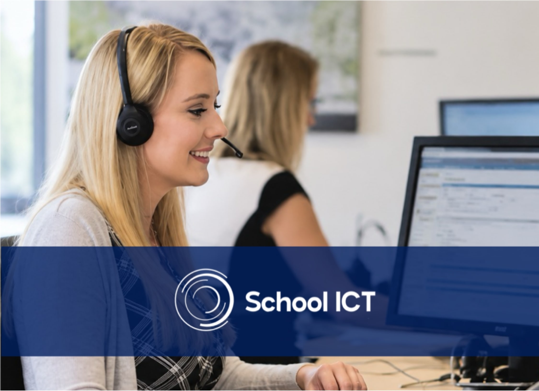 Woman at computer with headset on smiling