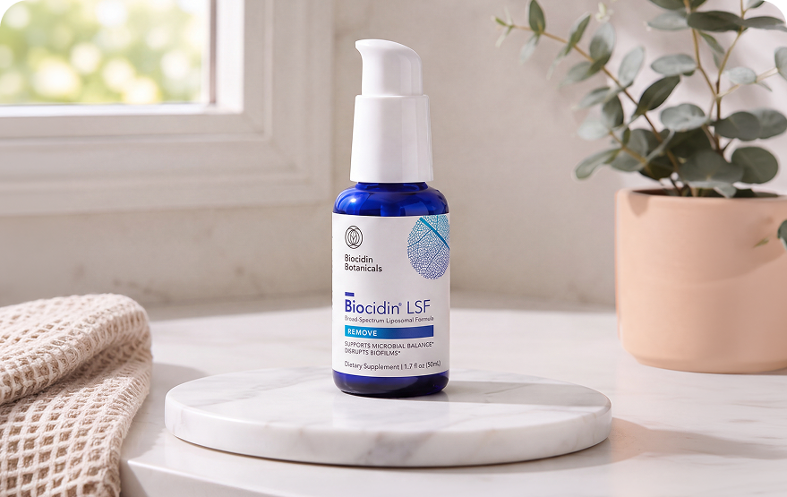 Hand holding Biocidin LSF bottle