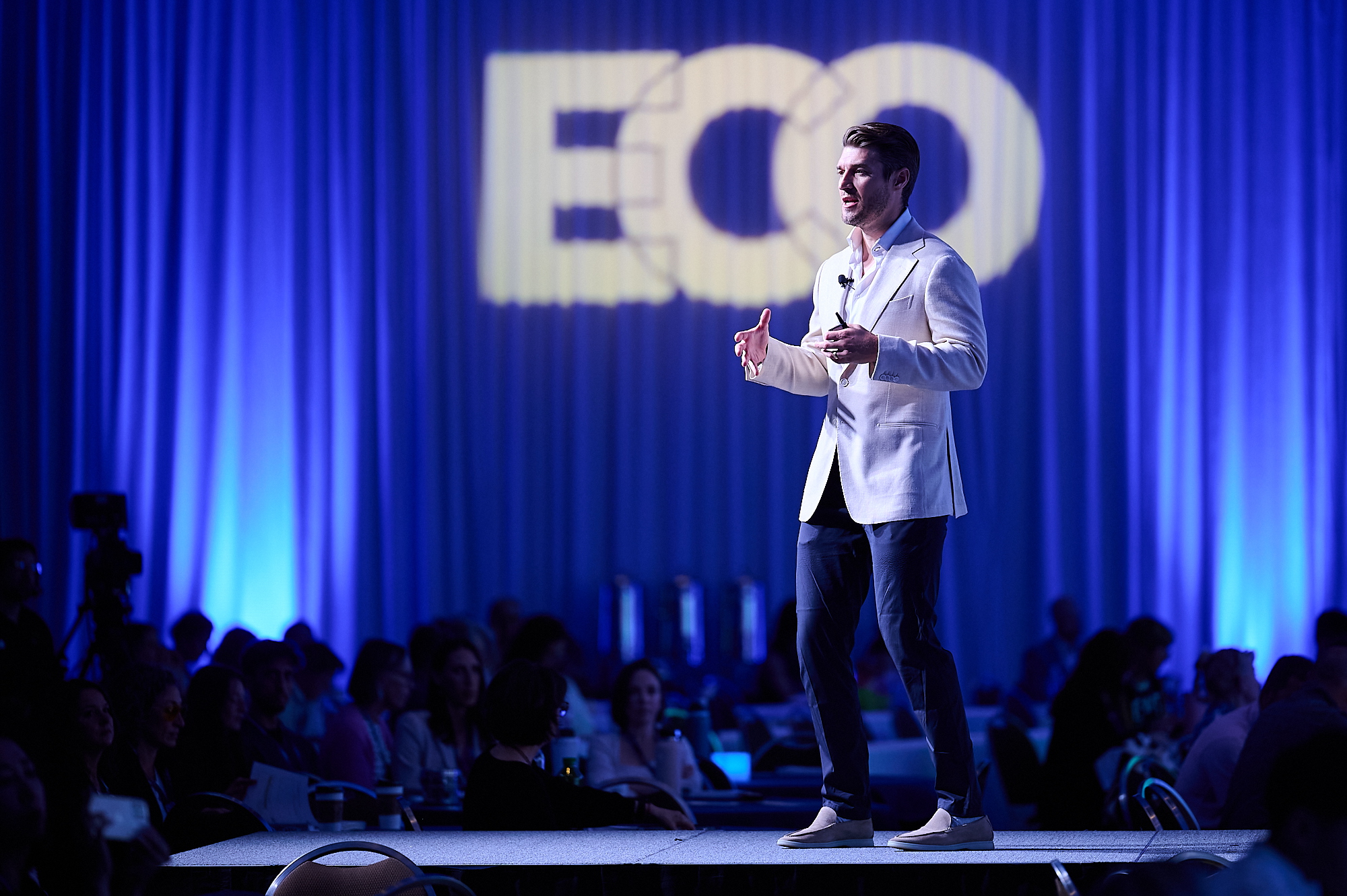 Speaker on stage at the ECO conference