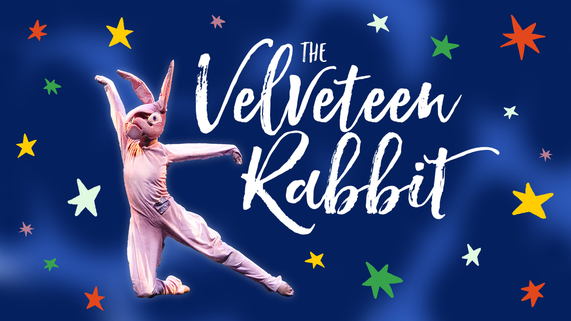 The Velveteen Rabbit jumping next to the The Velveteen Rabbit logo against a dark blue background with colorful stars