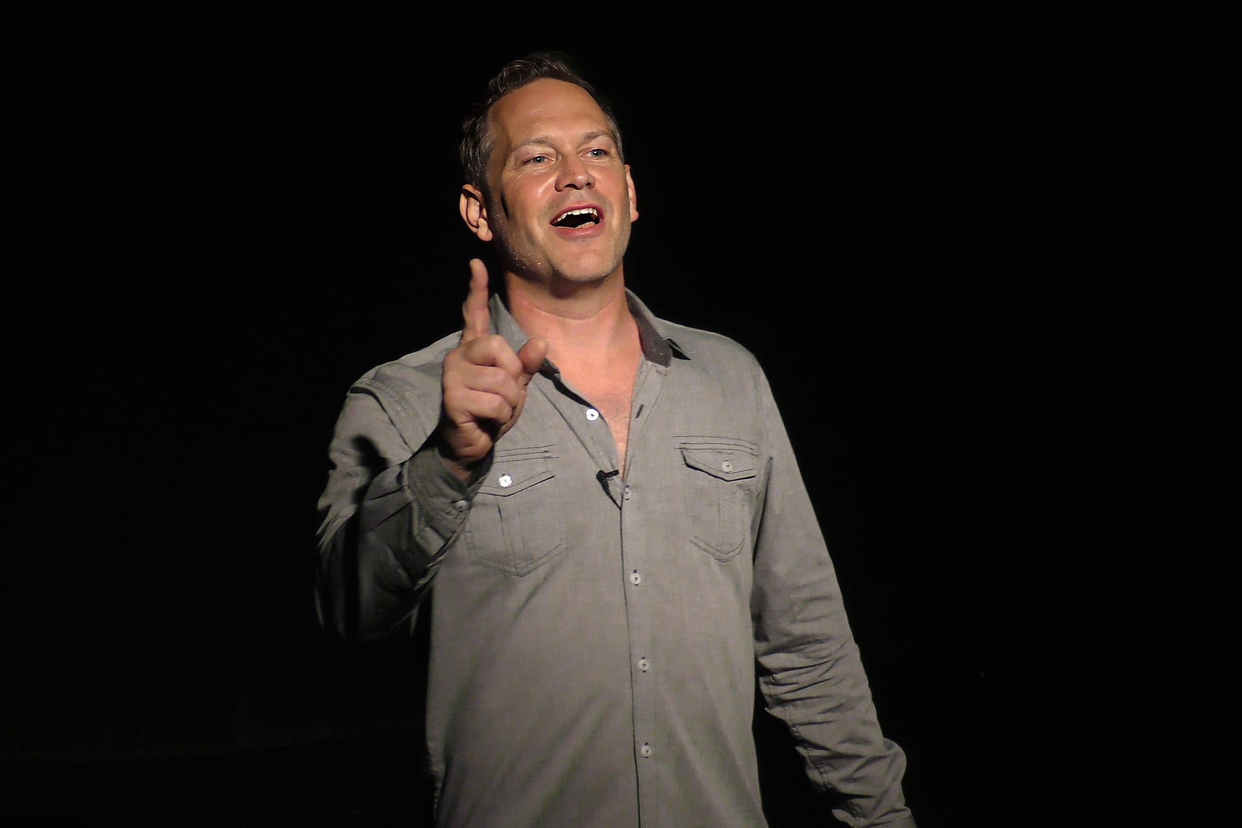 David Rodwin landing a joke while telling a story onstage