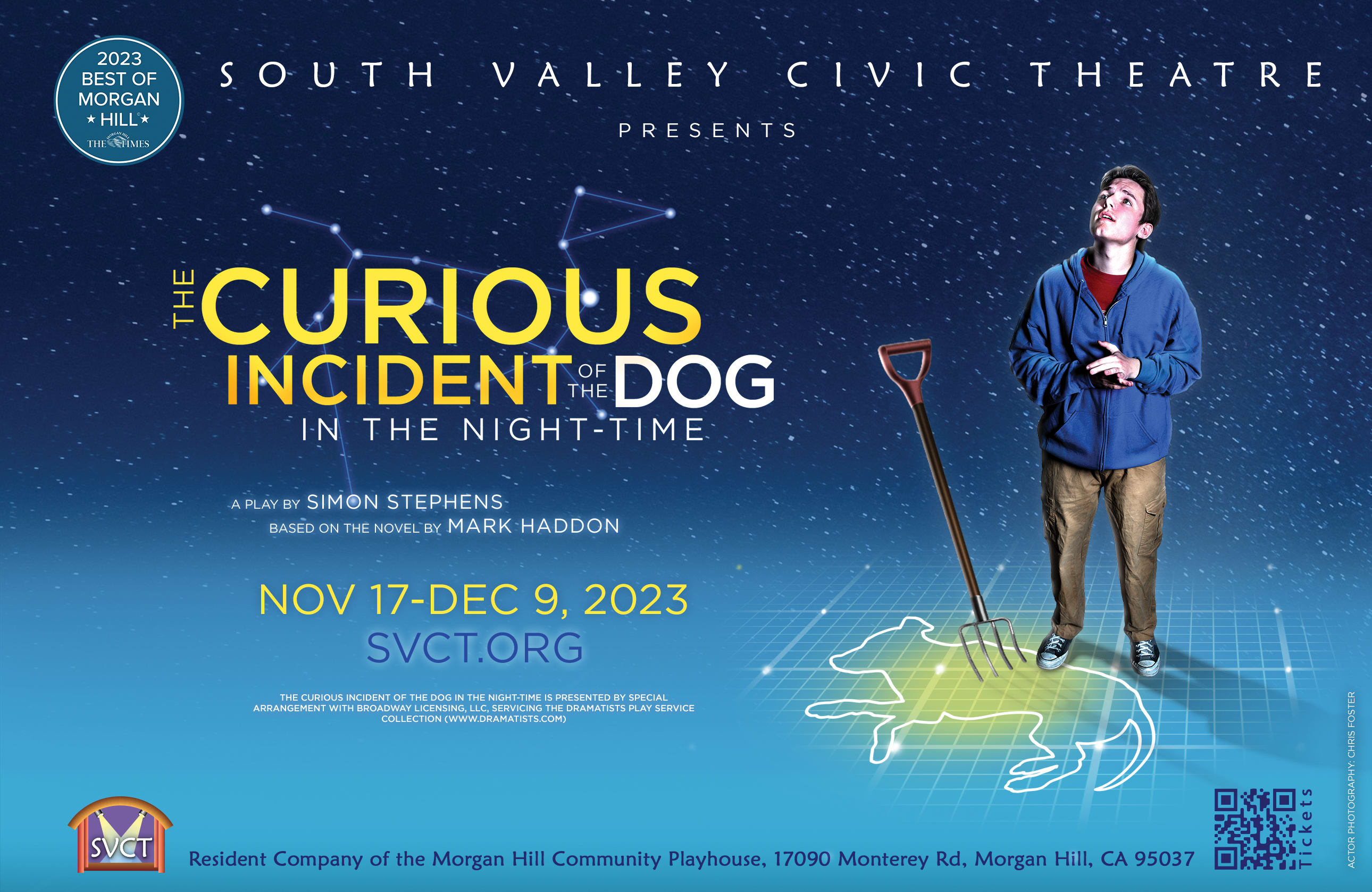 Christopher stands above the dog, looking up