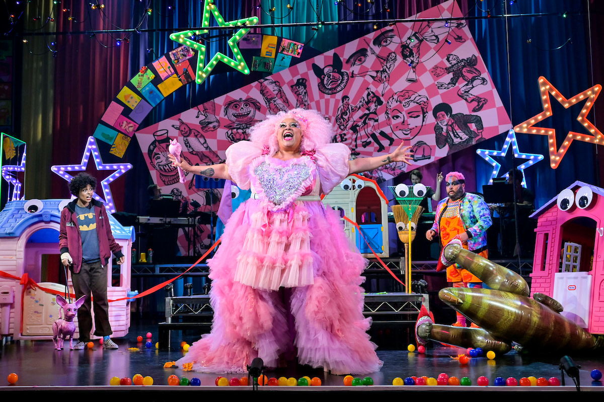 A bright, vibrant Munchkinland featuring Glinda the Good Witch