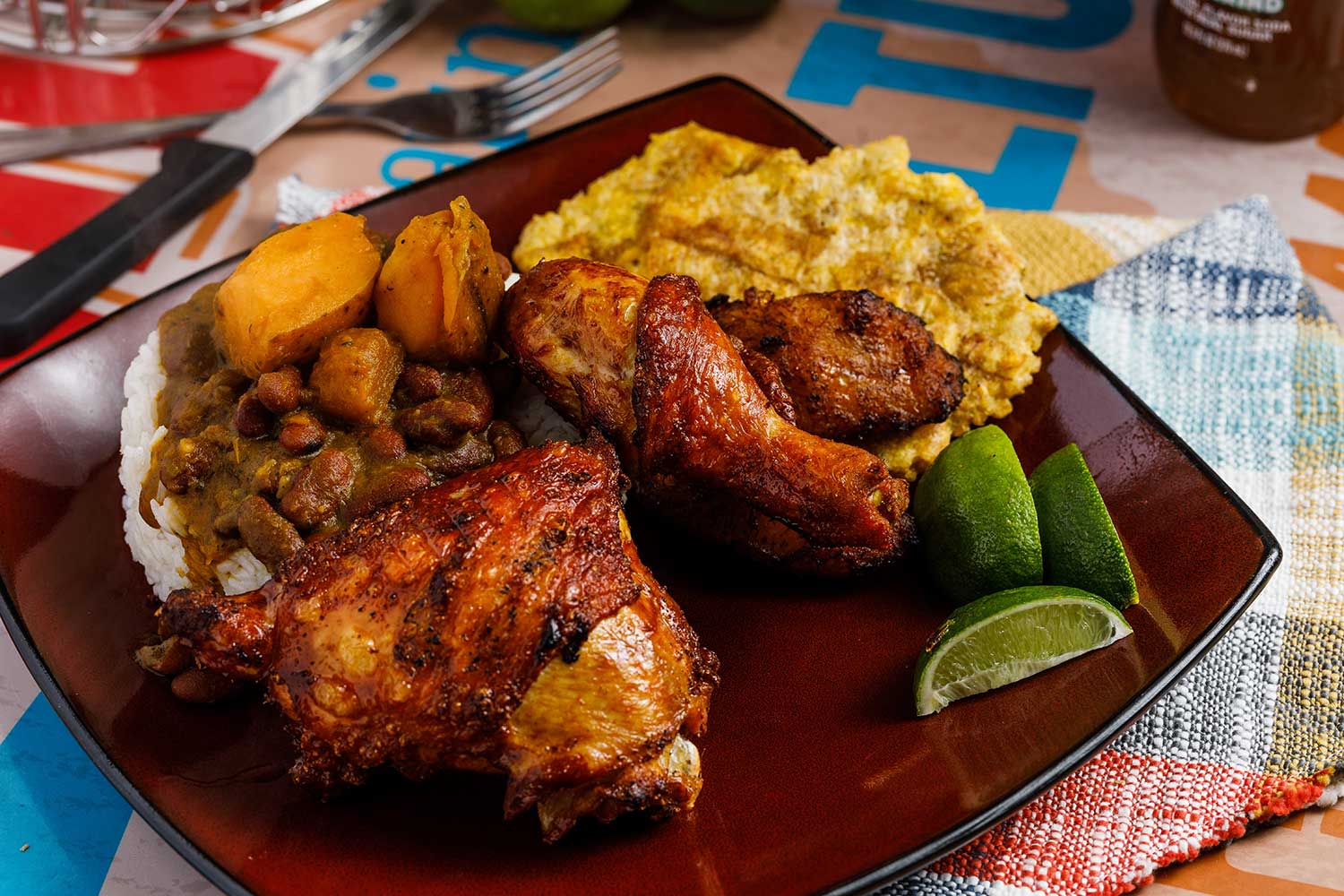 A hearty meal of chicken, rice, and plantains, showcasing Chazito's Latin flavors.