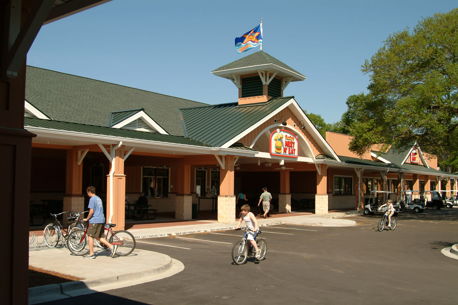 Guests ride bikes to Ocean Lakes' Camptown Center.