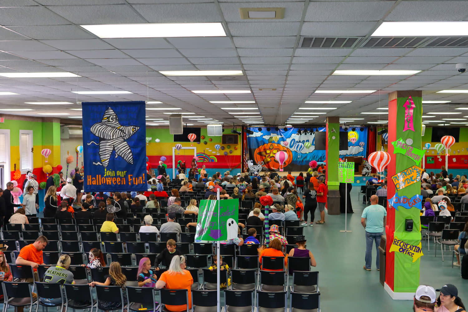 Ocean Lakes Recreation Center with seated guests audience, stage, and more.