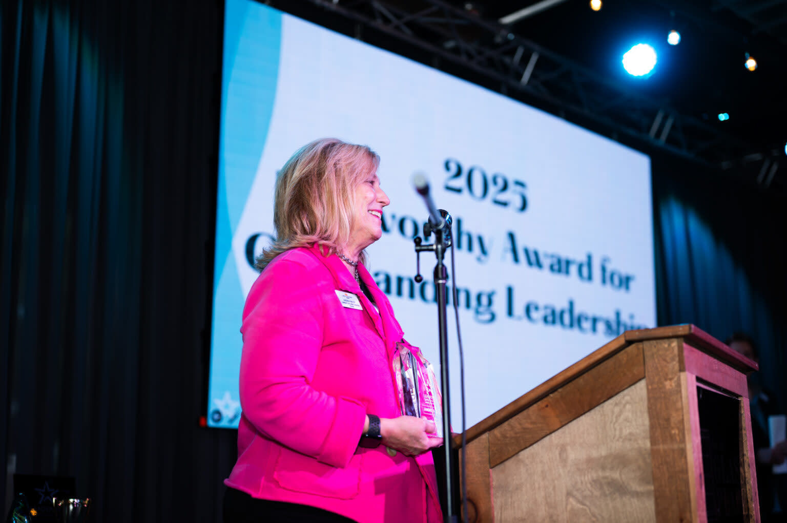 Andrea Brady accepting 2025 Kenworthy Award for Outstanding Leadership