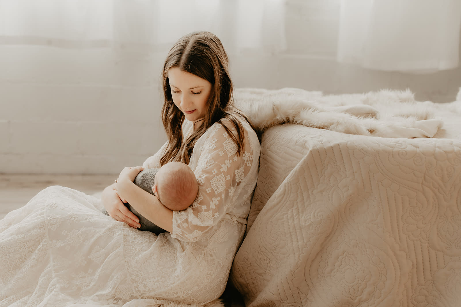 new mom holding her newborn baby boy