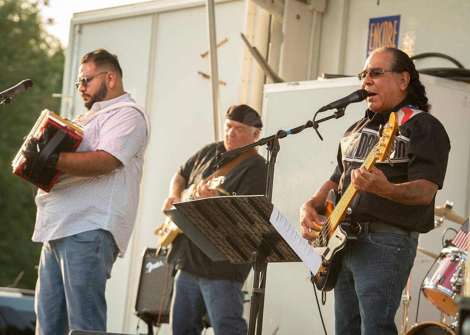 Los Rebeldes performing outdoors