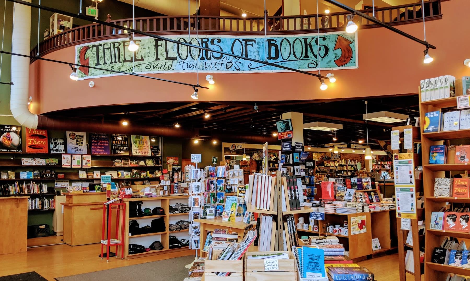 The main floor of Village Books with a view of the mezzanine balcony