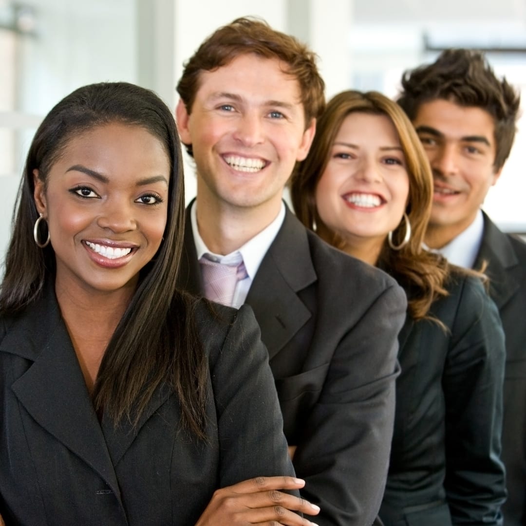 A group of young professionals smiling
