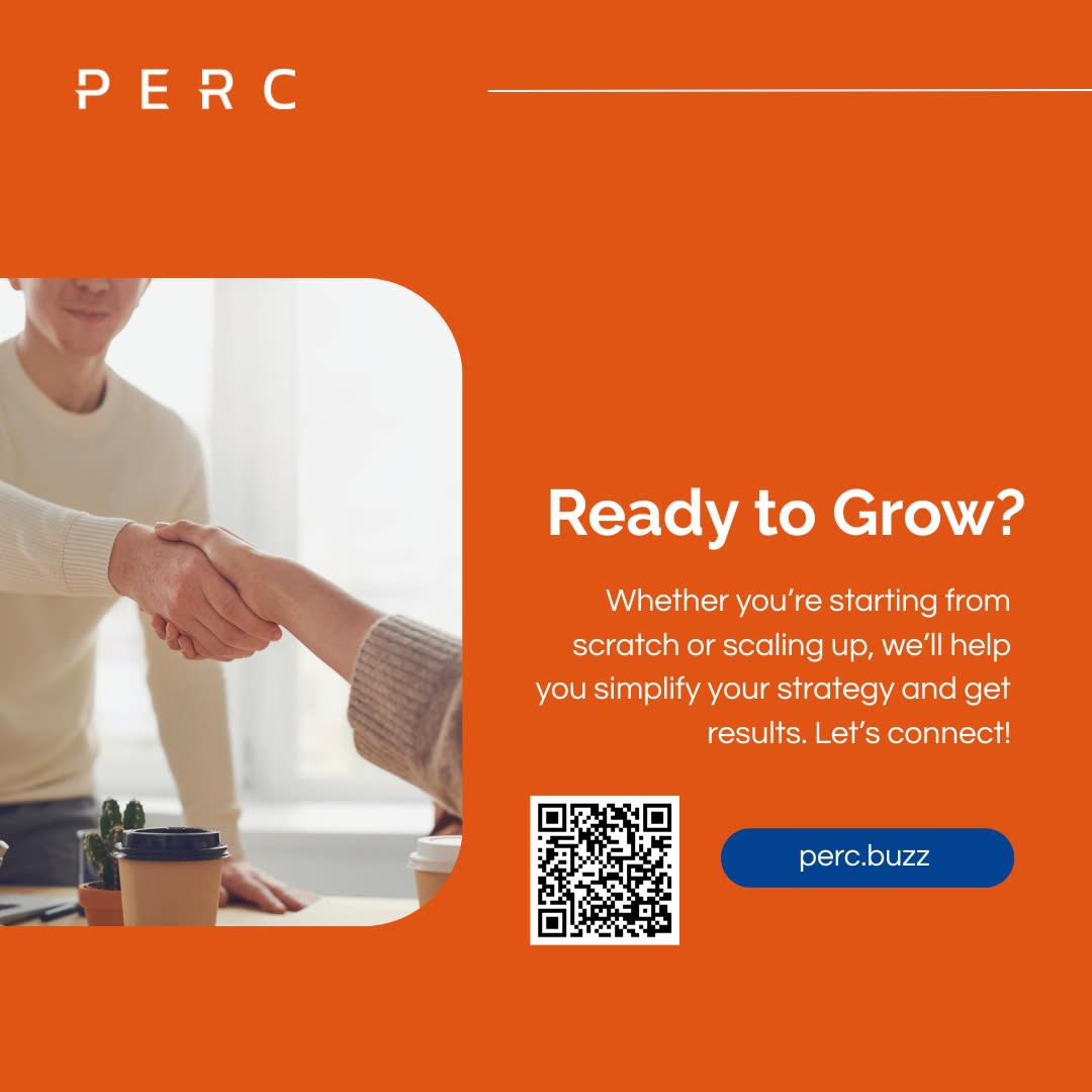 Handshake between two people at a business meeting with coffee cups on the table.