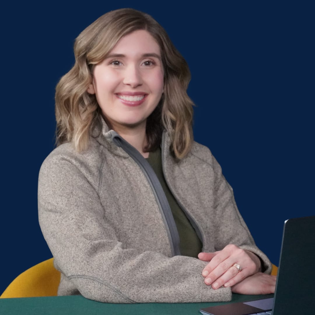 Close-up of Dietitian Melinda Benz Sitting at a Table with a Laptop