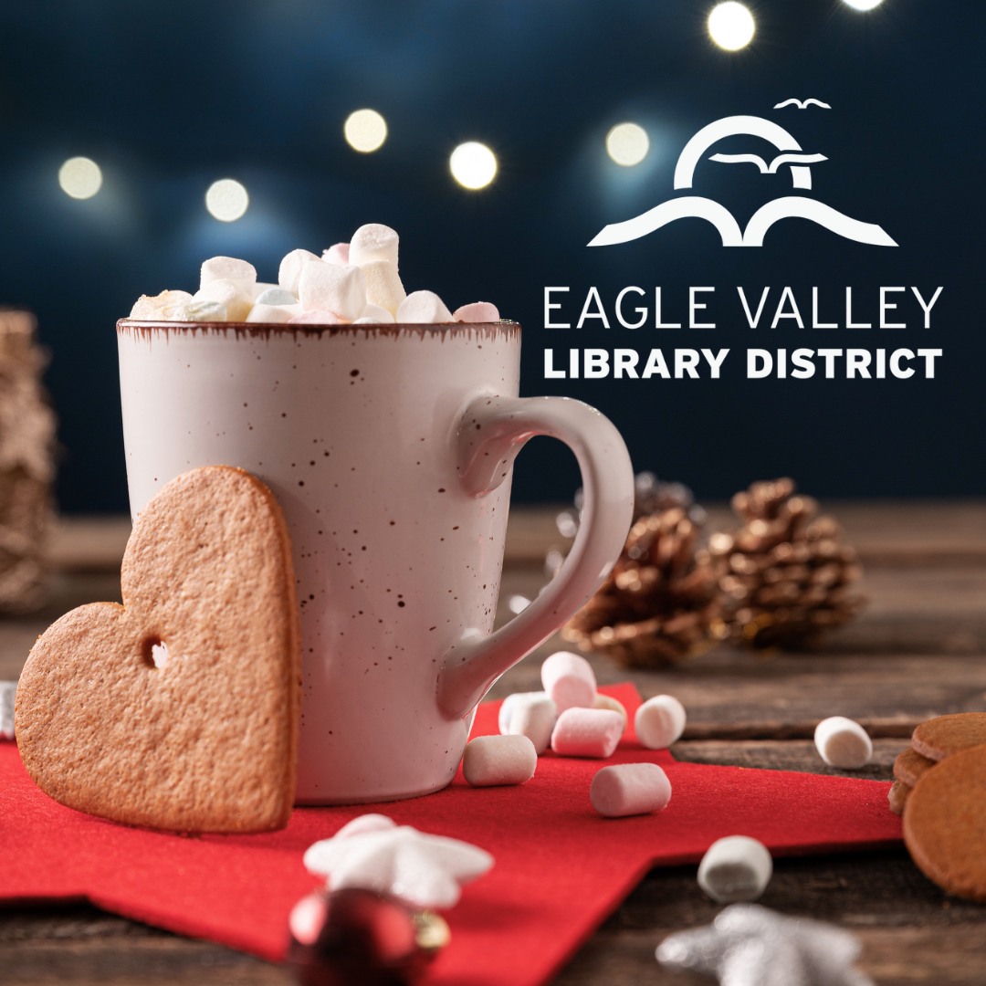 A cup of hot chocolate and heart shaped gingerbread cookies with the Eagle Valley Library District logo.